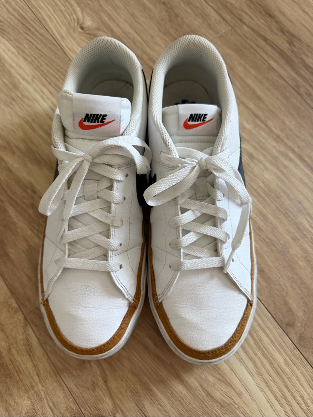 Nike White Sneakers with Brown Trim and Black Swoosh